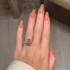 Rectangular cushion engagement ring with pavé shank and hidden halo