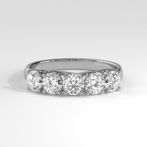 Elegant five-stone ring with round stones and polished tapered band